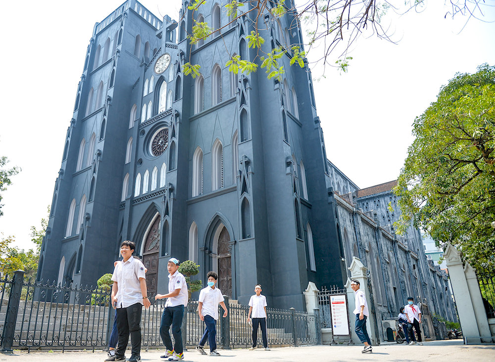 People admire St. Joseph’s Cathedral for its striking French Gothic design